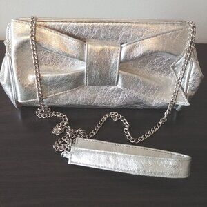 Le Chateau Silver Clutch, 10 x 5in. Pink satin inside with pocket,Good Condition
